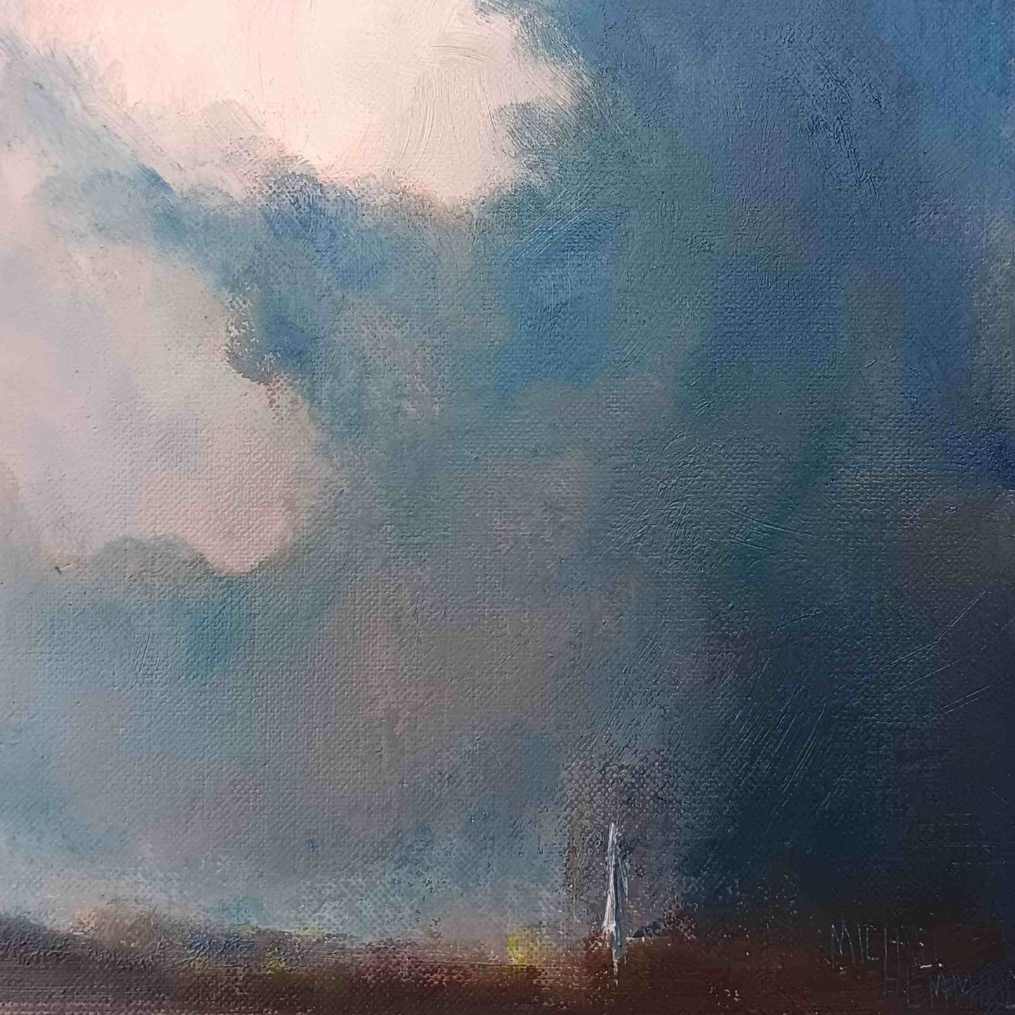 dramatic sky over salisbury with cathedral in distance