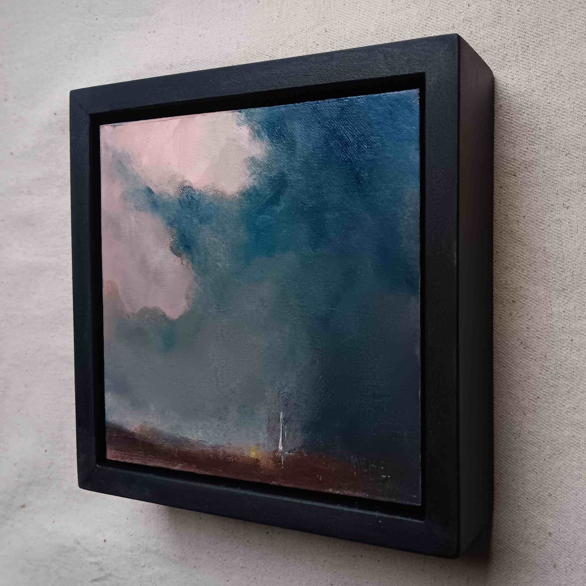 framed oil painting of a dramatic sky over salisbury with cathedral in distance