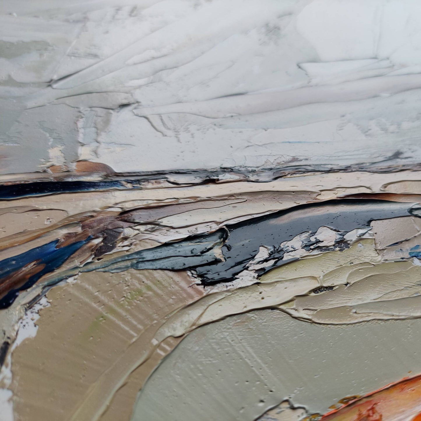 Close-up of textured paint surface with various colors and patterns