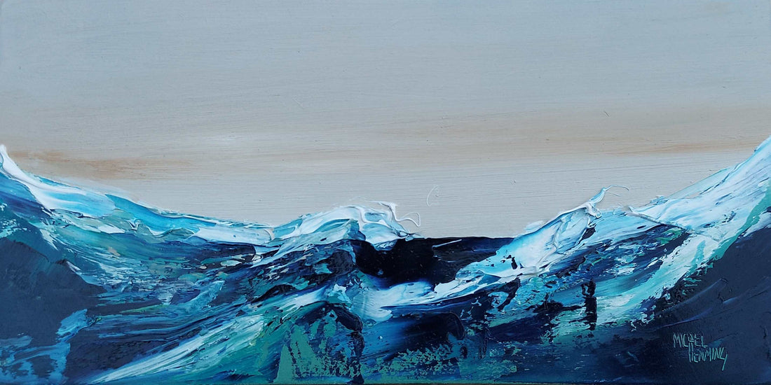 Restless sea with a calm sky featuring colours of inky blue, turquoise and green.