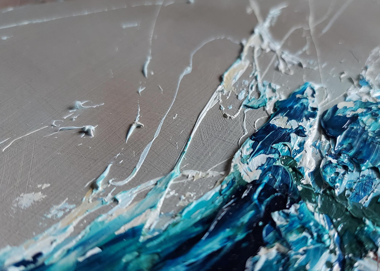 Detail of dramatic oil painting of a crashing wave with blue and gray colours