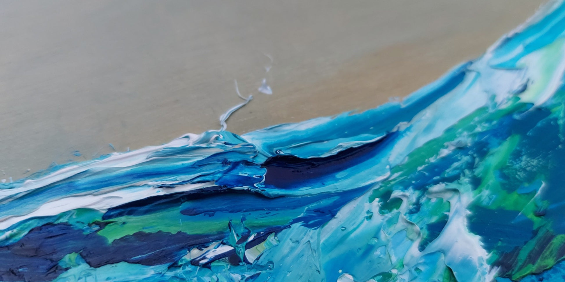 Detail of painting of a wave with blue and green colors