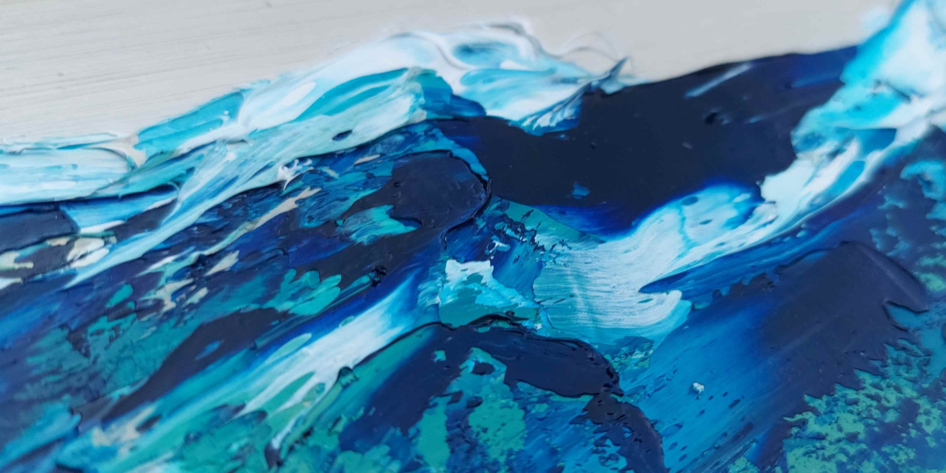 Seascape painting with blue and black strokes on a textured surface