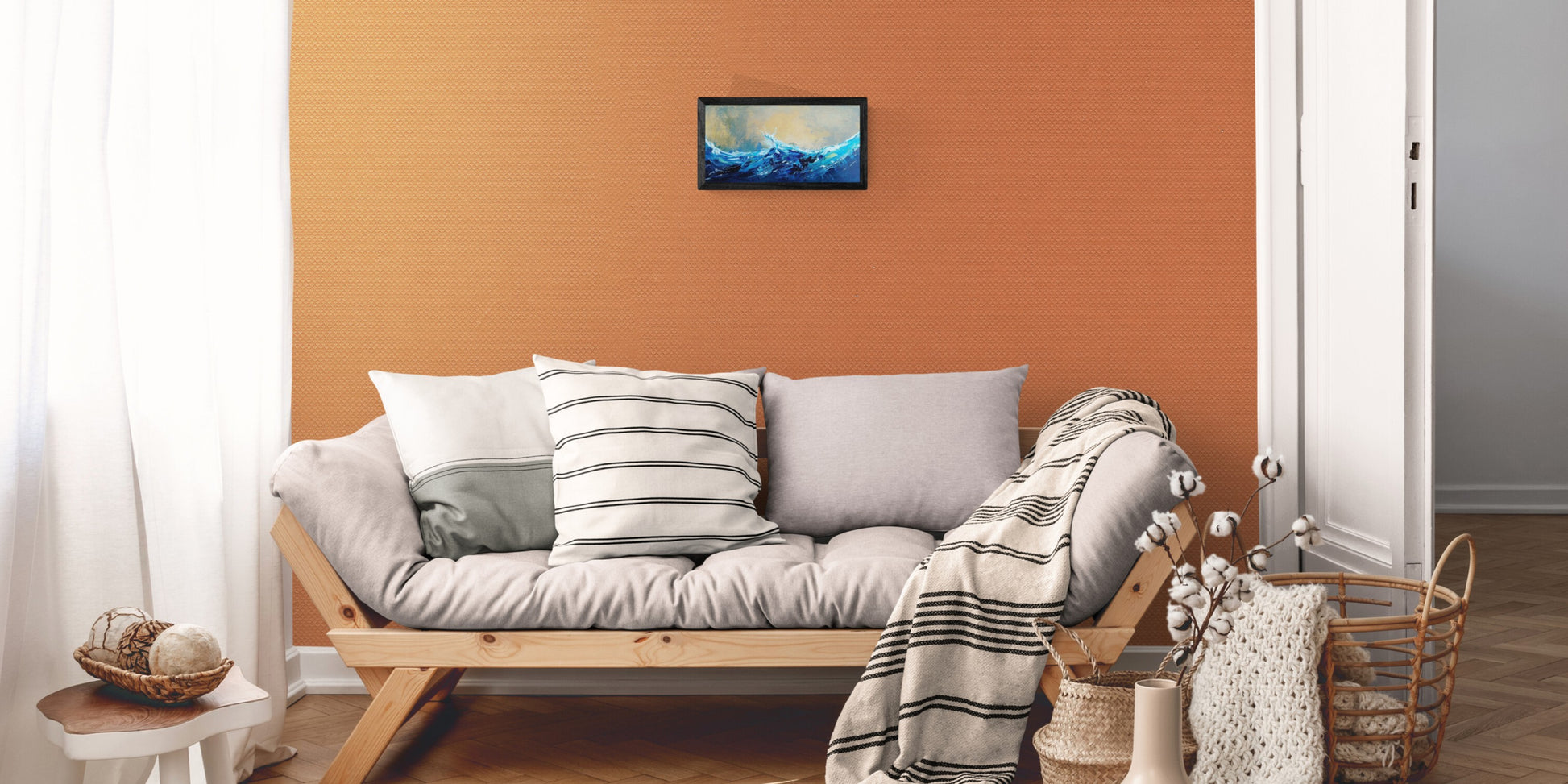 Wave painting on living room wall of complimentary orange