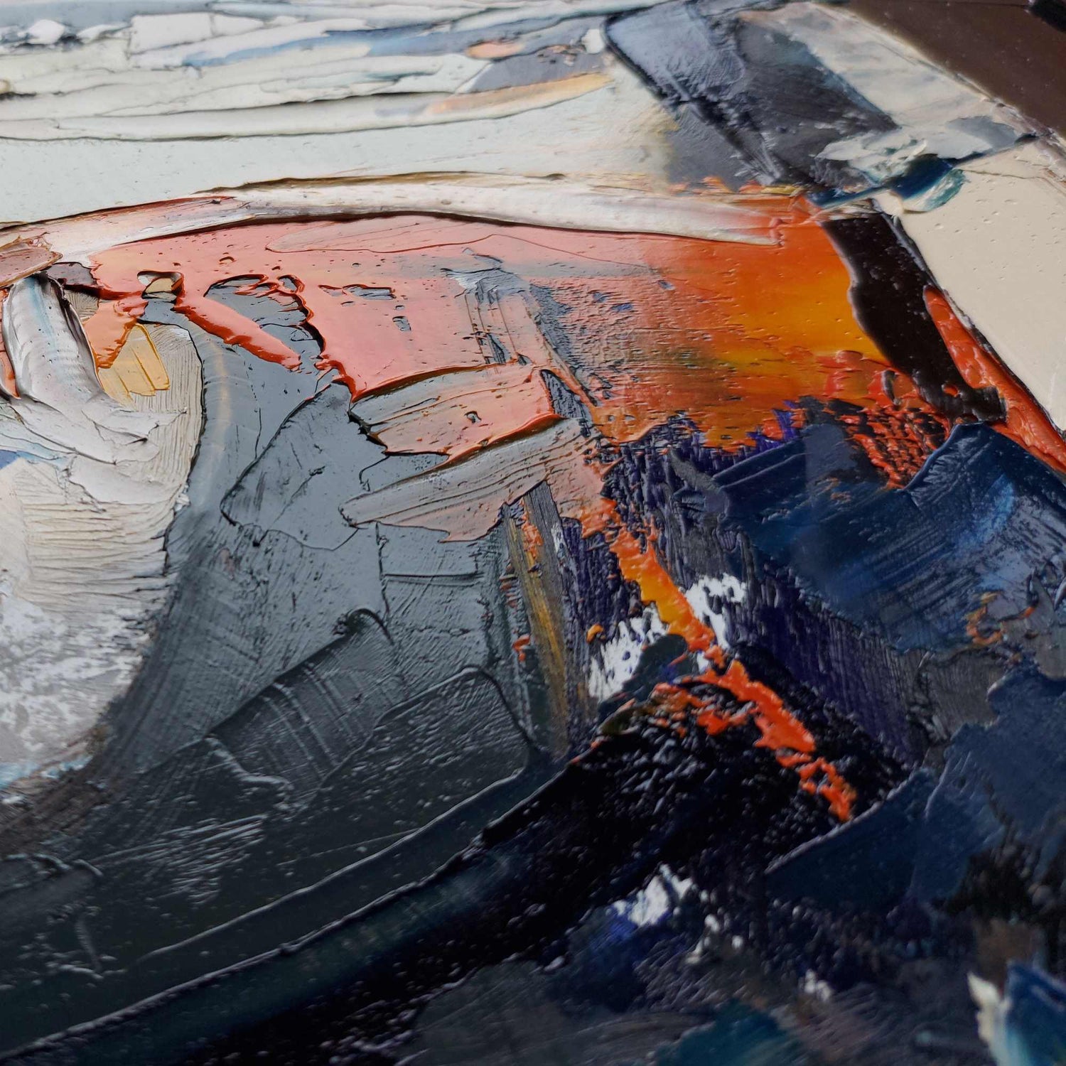 Abstract art with a mix of orange, blue, and gray colors.