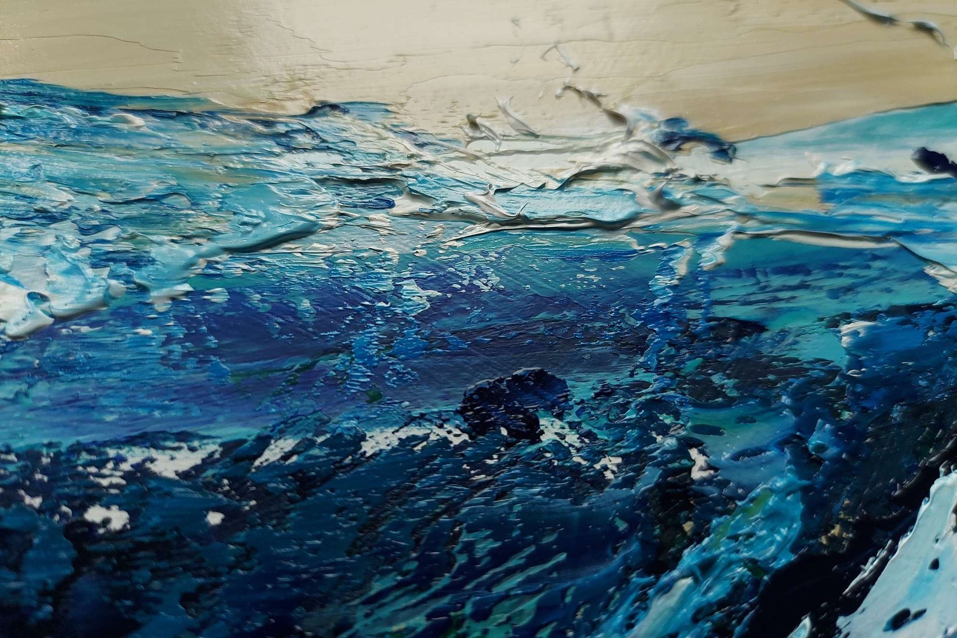 Abstract painting with blue and black strokes on a textured surface
