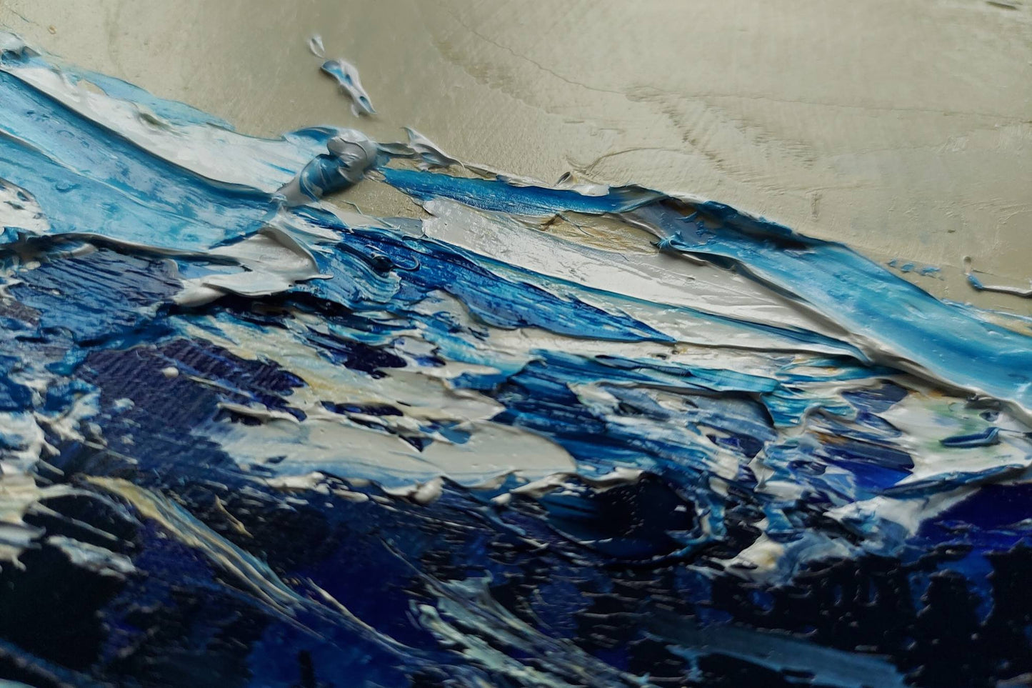 Abstract art with blue and white colors on a textured surface
